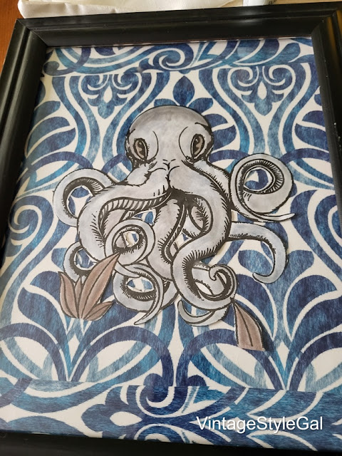 blue octopus in black frame