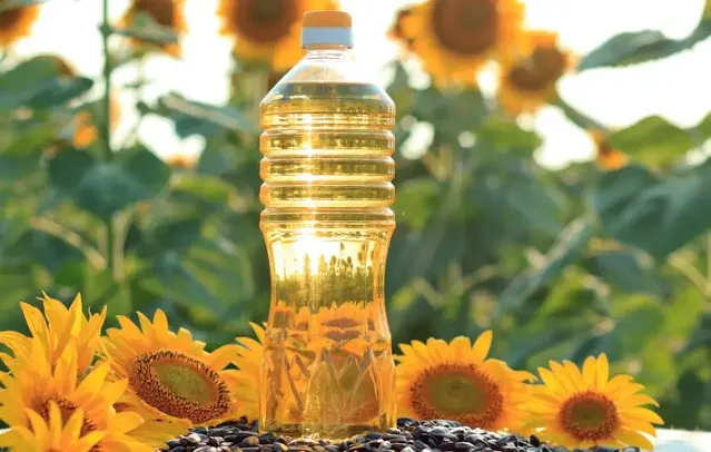 A Bottle of Sunflower Oil with Sunflowers