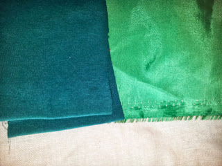 Colour test shot of a lighter and darker green fabric. Photo taken while I was debating whether the tree would be dark green on light green or the reverse