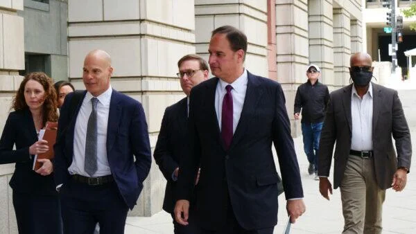 Michael Sussman (C) arrives for a court hearing at a federal courthouse in Washington on April 27, 2022