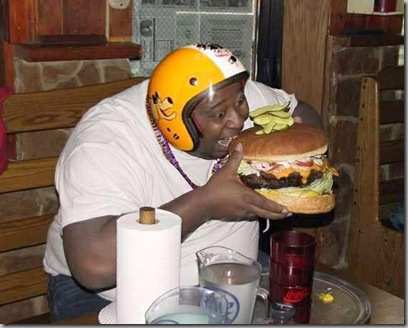 fat person eating burger. Ay yo, slim, you gon eat all