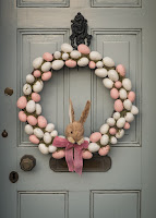 An Easter egg and bunny wreath. Photo by Roger Bradhsaw on Unsplash.