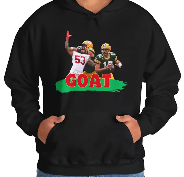 A Hoodie With NFL Player Aaron Rodgers Holding the Duke Moving Forward and the Text GOAT