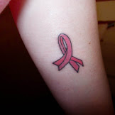 Small Breast Cancer Tattoo - Small Breast Cancer Ribbon Tattoo : A vibrant pink ribbon set both in front of and.