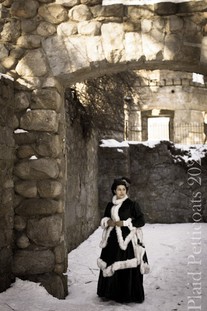 the author in her finished ensemble among stone walls and snow