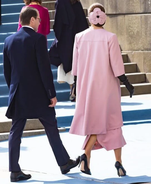 Crown Princess Victoria is wearing designer Christer Lindarw pink outfit, coat and dress, and headpiece