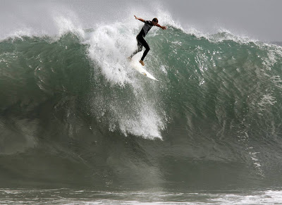 Surfers take to the 15-foot waves at the Wedge in Newport Beach