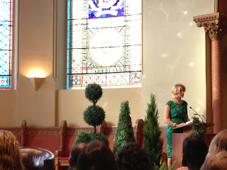 Elizabeth Gilbert reading at the podium