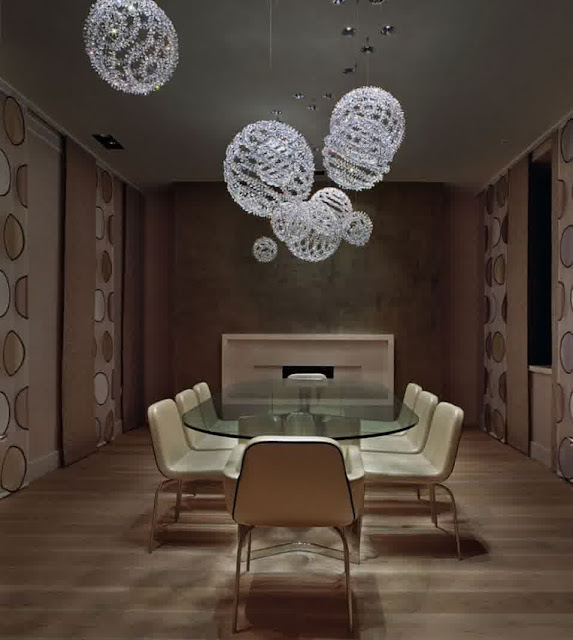 elegant natural room along with simple white hanging crystal possini lightings above oval glass dining table and modern light brown dining chairs