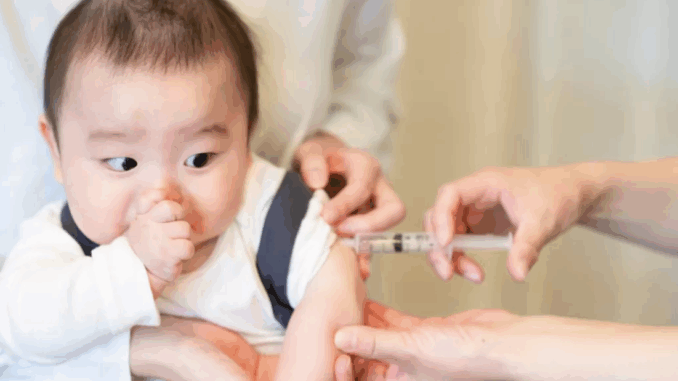 Infant receiving a vaccination at a pediatric clinic