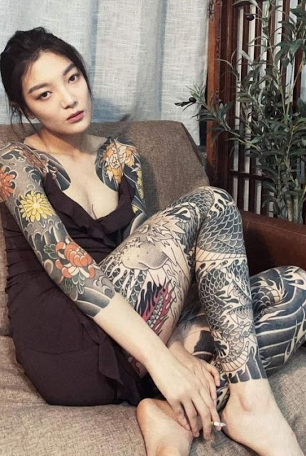 Faminine Dragon Tattoo on thigh