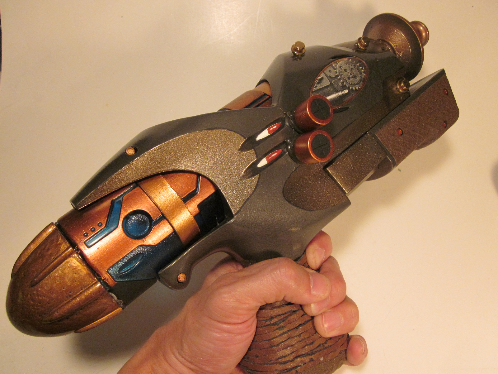 Steampunk Revolver Raygun with lights, full metal body plus wooden grip.  Made this from an older model. Which one do you like better? :  r/sciencefiction