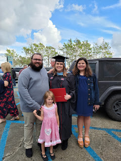 The blog writer, Katelyn Reulet, and her family. Brett (left), Katelyn (center), Aubree (right), and Avery (front center) at Katelyn's graduation.
