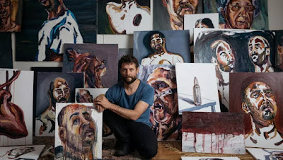 Ben Quilty with Myuran Sukumaran's paintings.  Photo: Daniel Boud