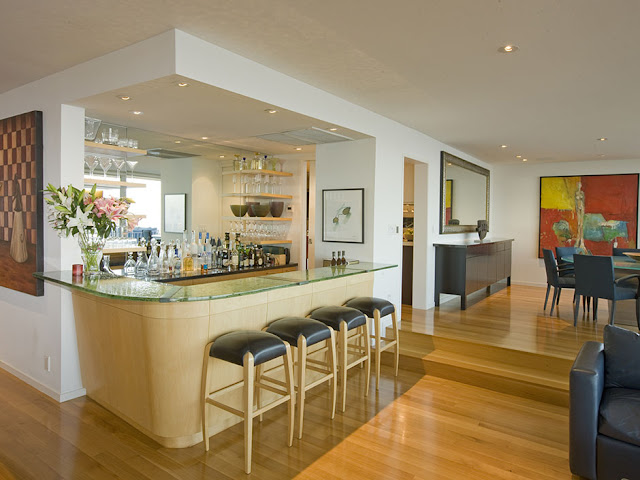 Picture of private wooden bar and four bar chairs in the modern mansion