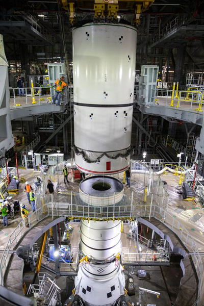 A full-scale replica of the Space Launch System's solid rocket booster is about to be assembled atop the mobile launcher inside Kennedy Space Center's Vehicle Assembly Building in Florida.