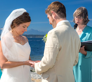 Drew and Alisha exchange rings at Golden Gardens - Patricia Stimac,Seattle Wedding Officiant