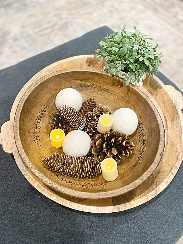 tray with bowl of pinecones and dryer ball snowballs