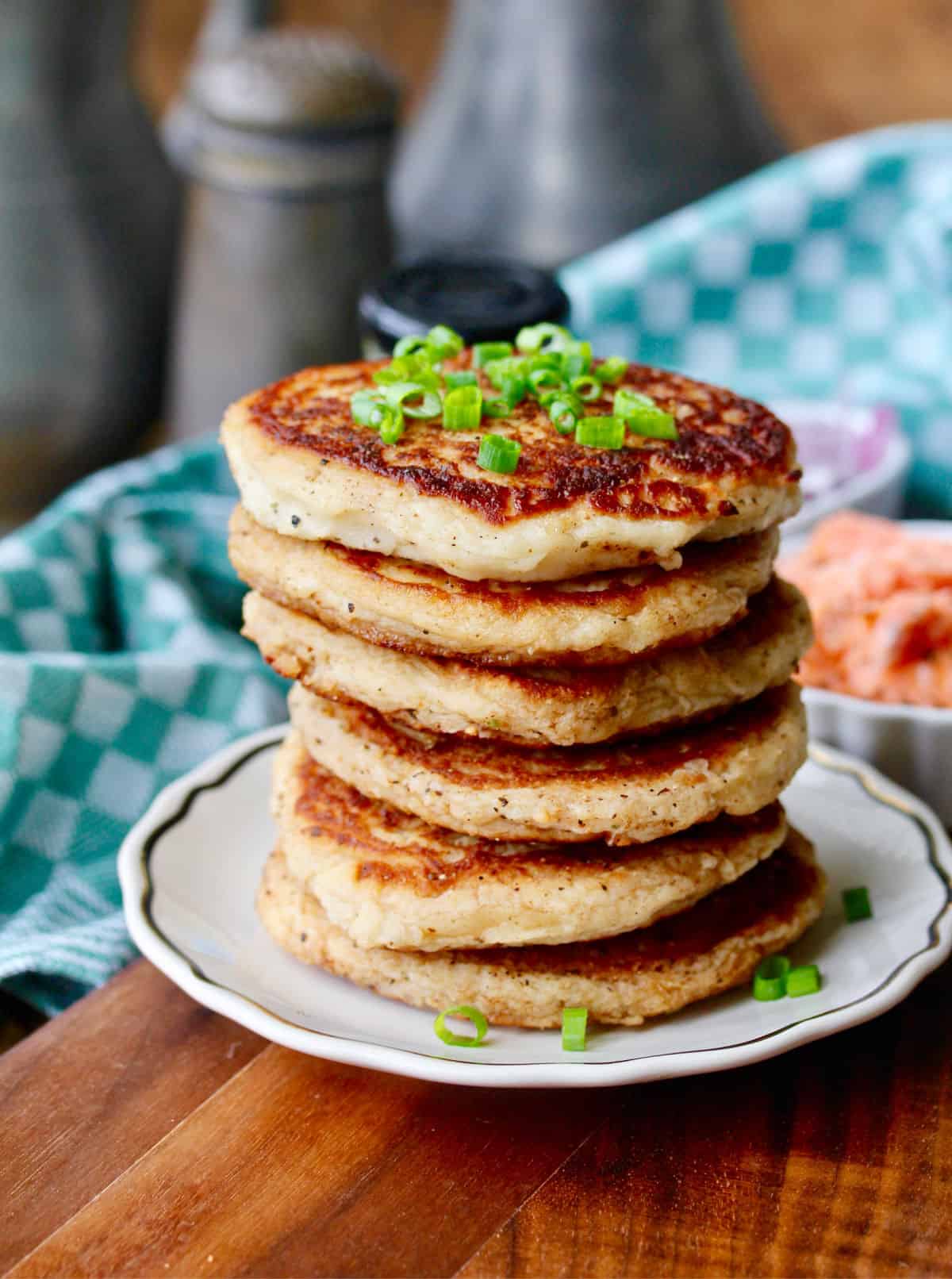 Tall stack of Irish Potato Cakes on a small plate.