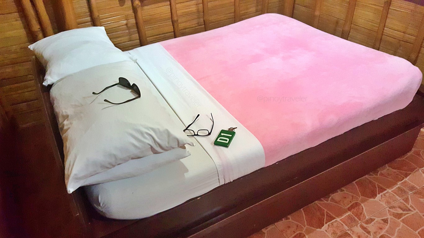 bedroom of Cottage D1 at Isla Jardin Del Mar Resort in Glan, Sarangani