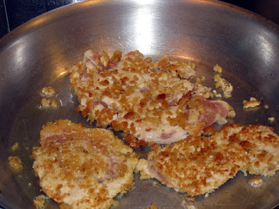 Breaded cutlets browing in sauté pan