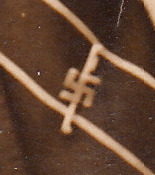 A tie with a swastika tie pin.