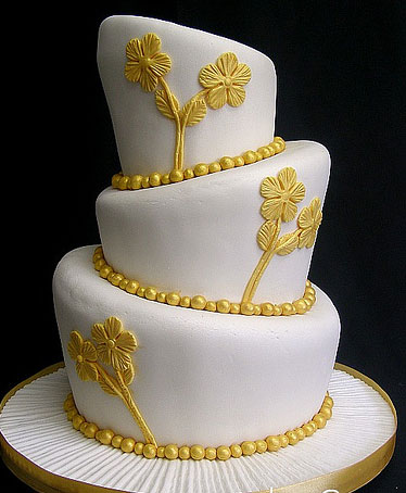 Gold wedding cake is frequently used for the 50th anniversary of a wedding