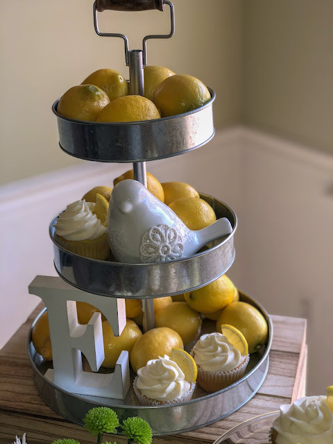 Yellow and White baby girl baby shower decoration ideas. You are my sunshine baby shower theme tips. Food and drinks. Lemon cupcakes. Fruit and yogurt parfait. Baby shower brunch