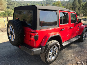 Rear 3/4 view of 2019 Jeep Wrangler Unlimited Sahara