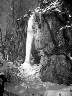 A black-and-white frozen waterfall