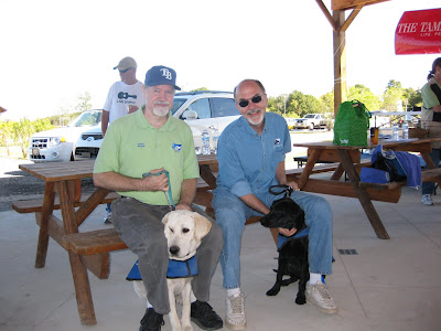 A picture of Johh, me, Dodger and Berkeley after the tradeoff. We're sitting on a picnic table.