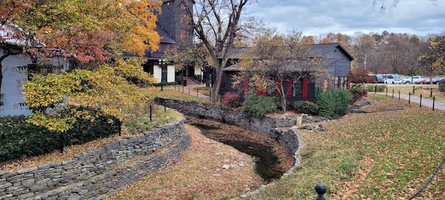 Fall foliage, leaves on ground, farm buildings