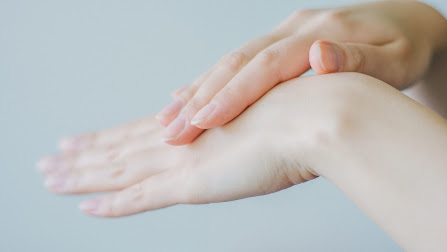 hands rubbing with products