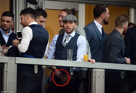 Shame! Popular Footballer Caught on Camera Urinating in Glass Cup Before Throwing it Over Railing (Photos)