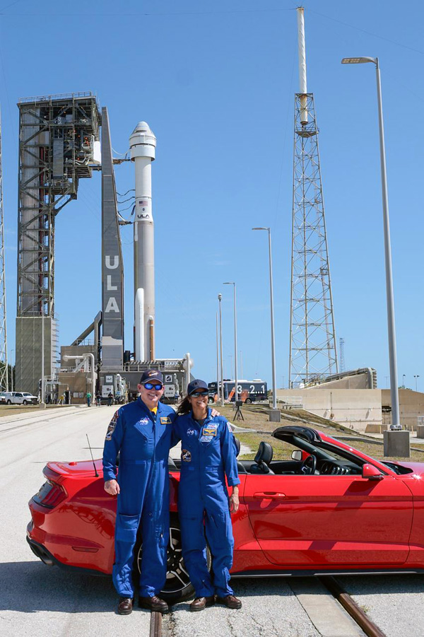 NASA astronauts and Crew Flight Test members Butch Wilmore and Suni Williams pose in front of the Atlas V rocket and their Starliner Calypso capsule at Cape Canaveral Space Force Station's SLC-41 pad in Florida...on May 4, 2024.