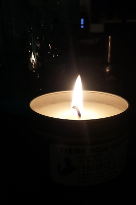 A candle that smells like tobacco, coffee, gun oil and Old Spice