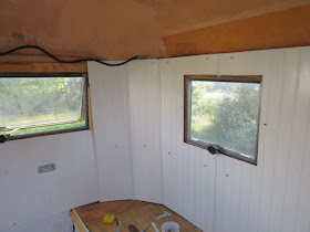 white paneling inside a fiberglass trailer