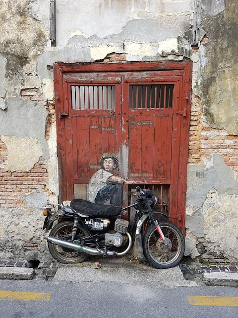 penang street art mural lebuh ah quee boy on a motorcycle