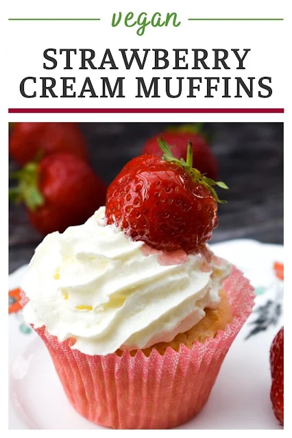 Soft vanilla vegan muffins filled with strawberry jelly glaze and topped with cream and a glazed strawberry for afternoon tea or sharing with friends.
