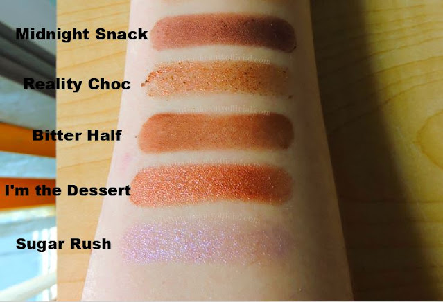 Swatches of five shadows from Too Faced Better Than Chocolate Eyeshadow Palette. Text reads Midnight Snack, Reality Choc, Bitter Half, I'm the Dessert, Sugar Rush