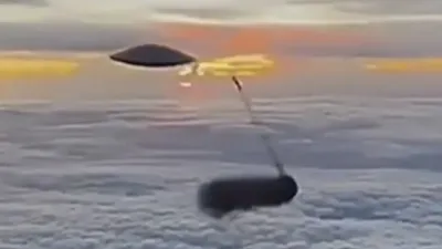 The UFO sighting from the window of the airplane shows it was shot with a missile.