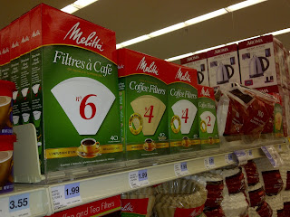 Packages of cone coffee filters on store display