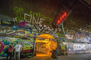 Graffiti in an old arched tunnel