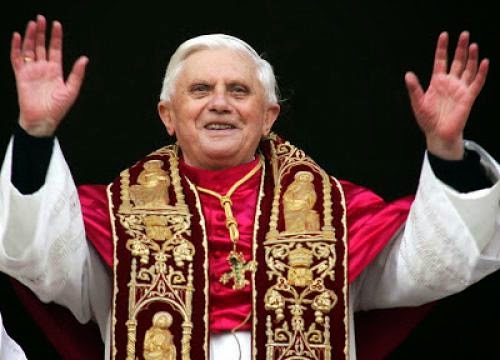 Rev Father Burns Pope Benedicts Photo During Sermon