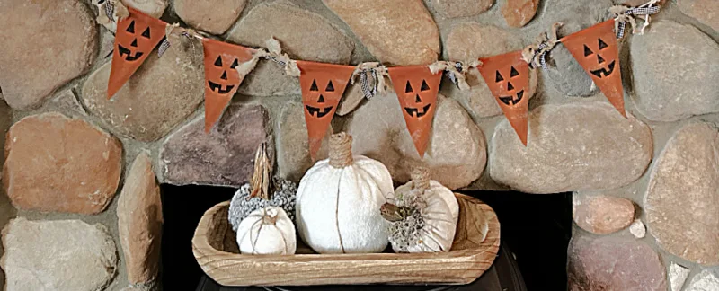 banner and pumpkins on mantel