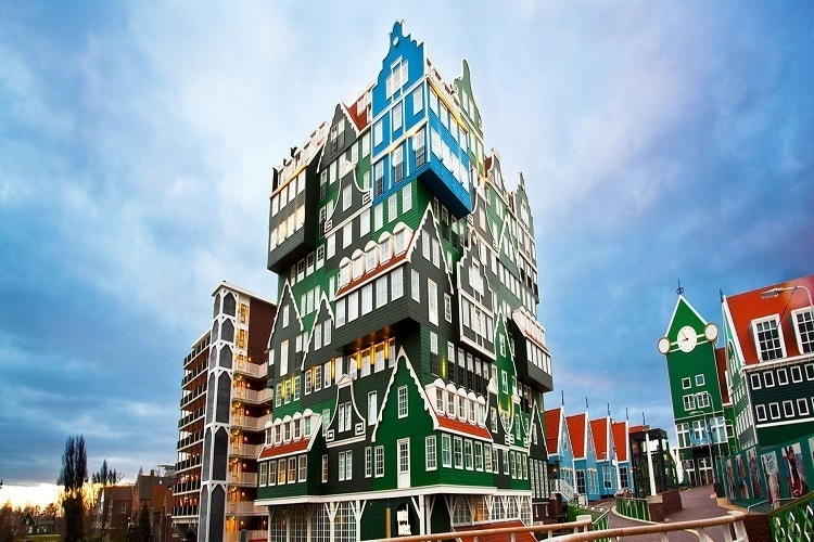  14 Crazy Hotels That Will Give You Serious Travel Goals - The Amsterdam Zaandam Inntel Hotel in the Netherlands looks like a puzzle and takes its inspiration from historic Dutch architecture: Whimsical, bright, and totally cool.