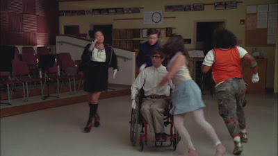 Kurt, Tina, Mercedes, Rachel, and Artie as their freshmen selves performing Sit Down You're Rocking the Boat