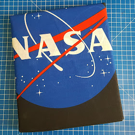 ISA NASA bedding shown folded with NASA logo