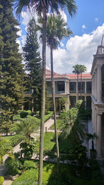 Lush and tranquil inner gardens at Palacio Nacional El Salvador, a hidden oasis of serenity.