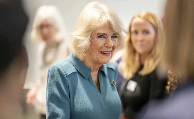 Queen Camilla wore a blue grey midi dress by Fiona Clare, and a blue coat. NHS Foundation Trust the Royal Free Hospital